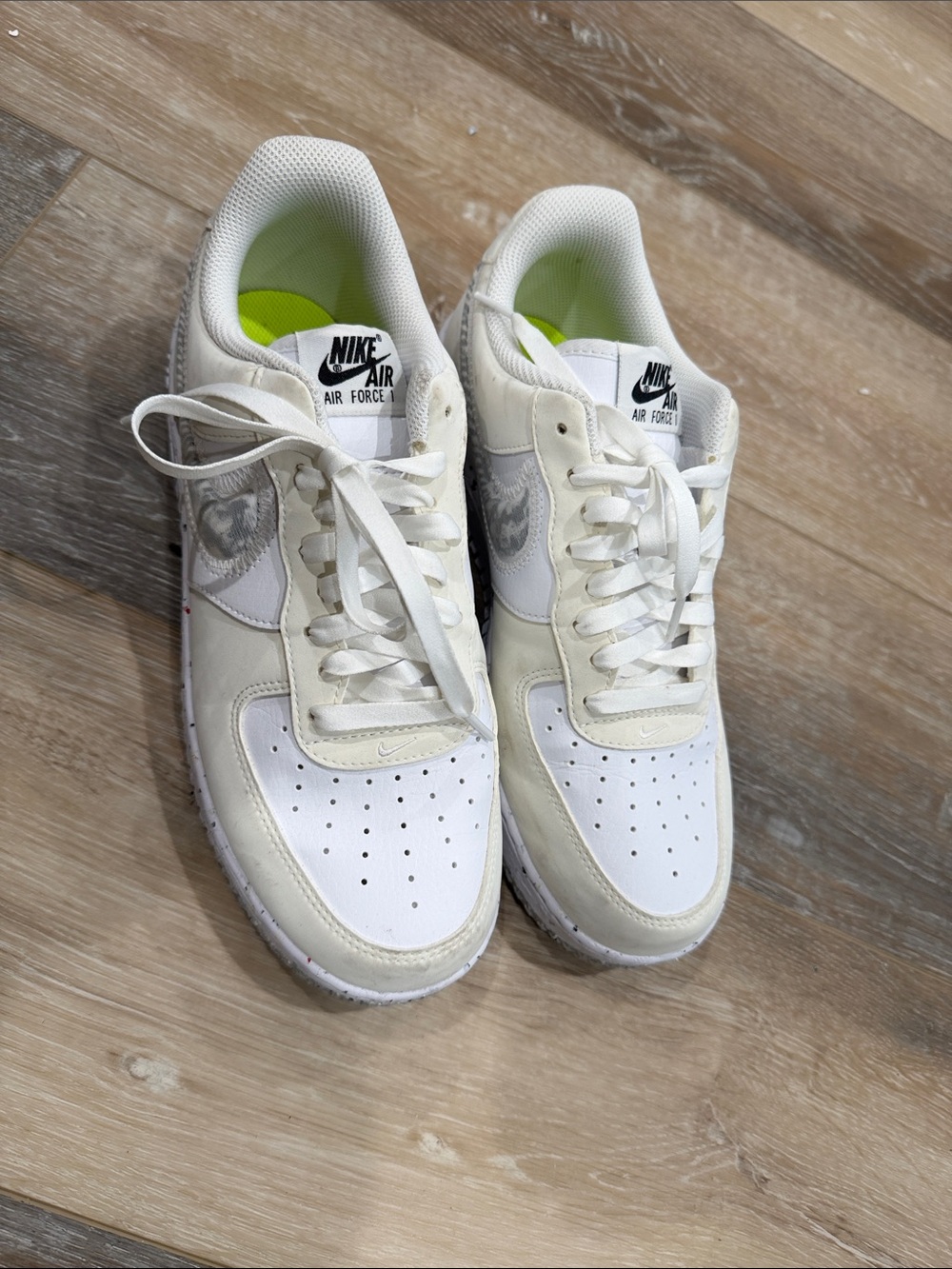 Air Force 1’s.  Nike White Low-Top Sneakers with Lime Insoles